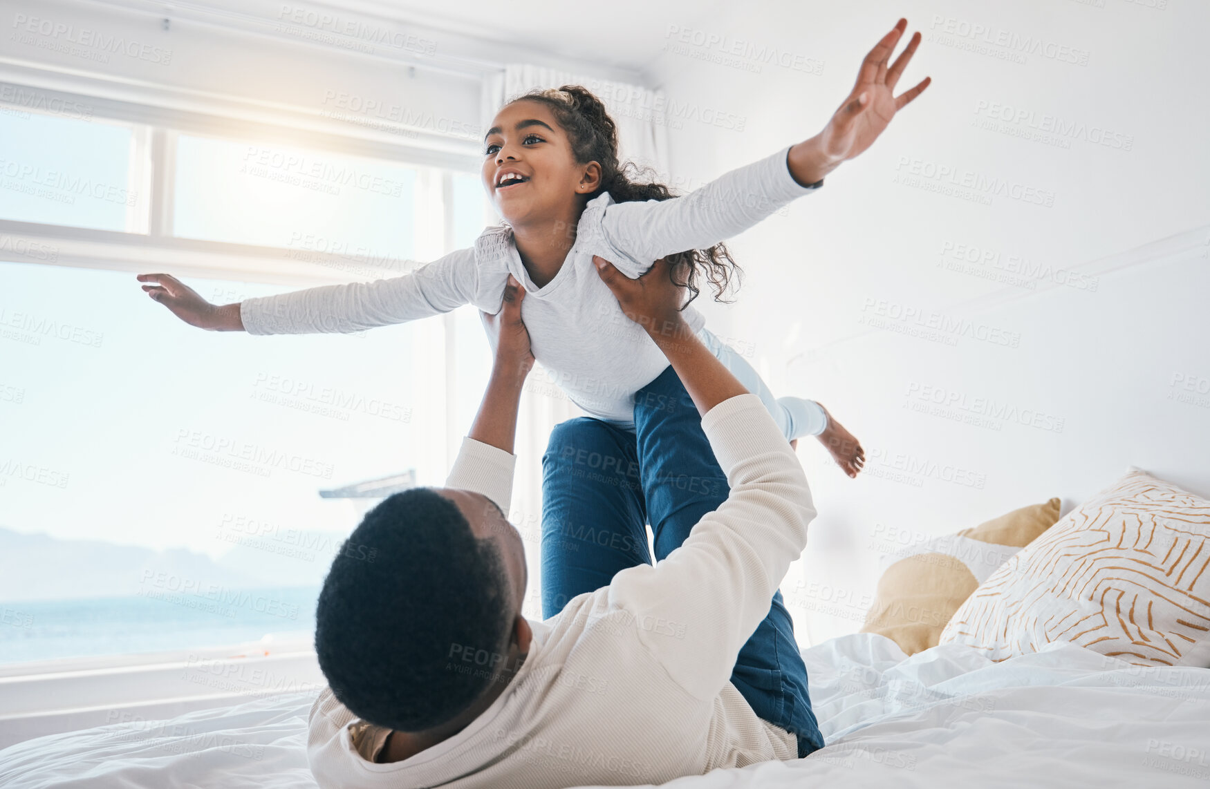 Buy stock photo Airplane, love and father with girl child on a bed for bond, trust or support in their home together. Flying, family time and parent with kid in a bedroom for games, play or fun with weekend freedom