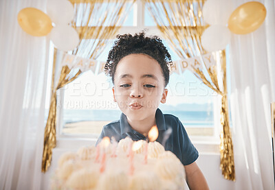 Birthday, cake and party with child and candles for gift celebration, food and dessert. Excited, balloons and happy with young boy making wish in family home for surprise, flame and holiday event