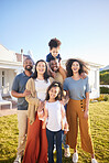 Children, parents and grandparents at house outdoor to relax for summer vacation. Men, women and kids or interracial family portrait together at holiday home or real estate property with blue sky