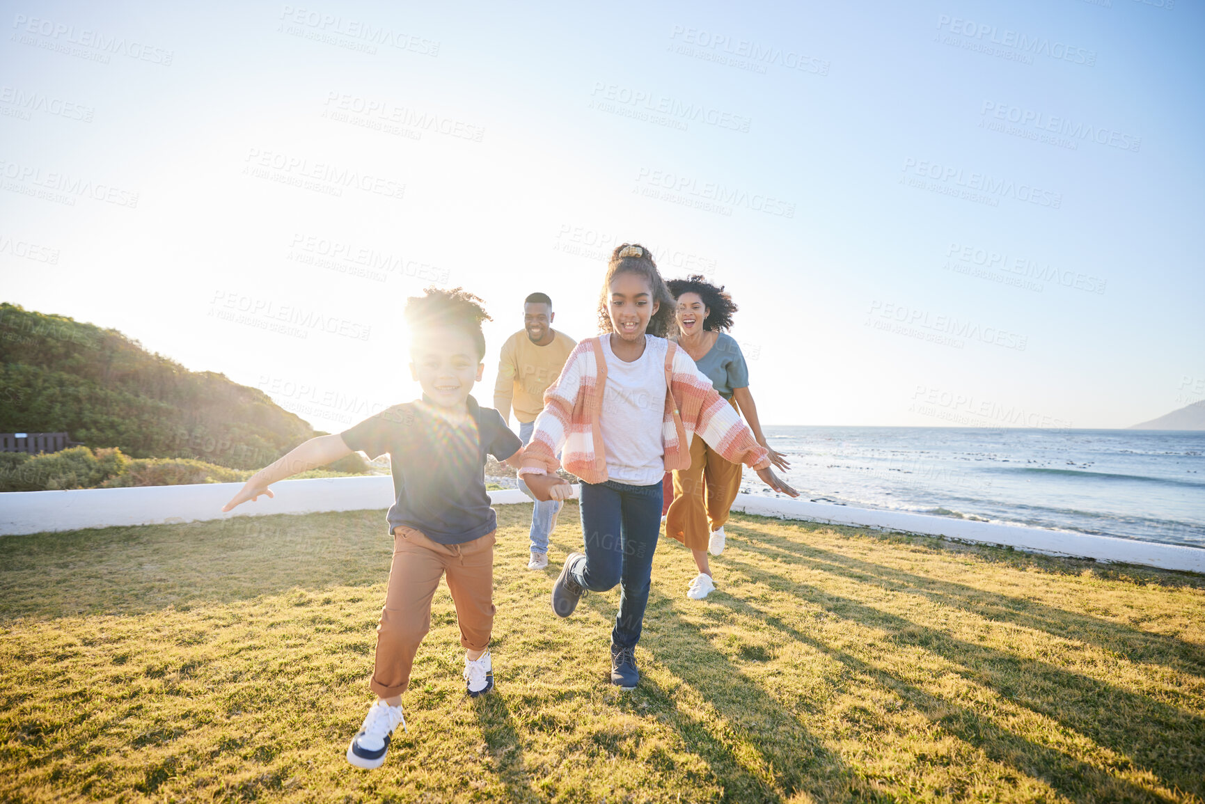 Buy stock photo Nature, kids and excited family running, having fun and playing games, chase and bonding on countryside vacation. Energy, freedom and happy children, mother and father love, care and smile on field