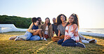 Beach, smile and family relax on vacation, bonding and having fun together on grass on mockup space. Grandparents, happy and interracial parents with kids at ocean to travel on holiday, care and love