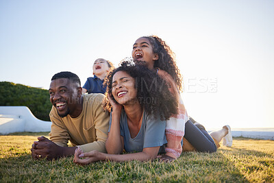 Buy stock photo Grass, funny and family relax on vacation, bonding and having fun together on mockup space. Children, laughing and interracial parents in nature to travel on holiday, care and love outdoor at garden