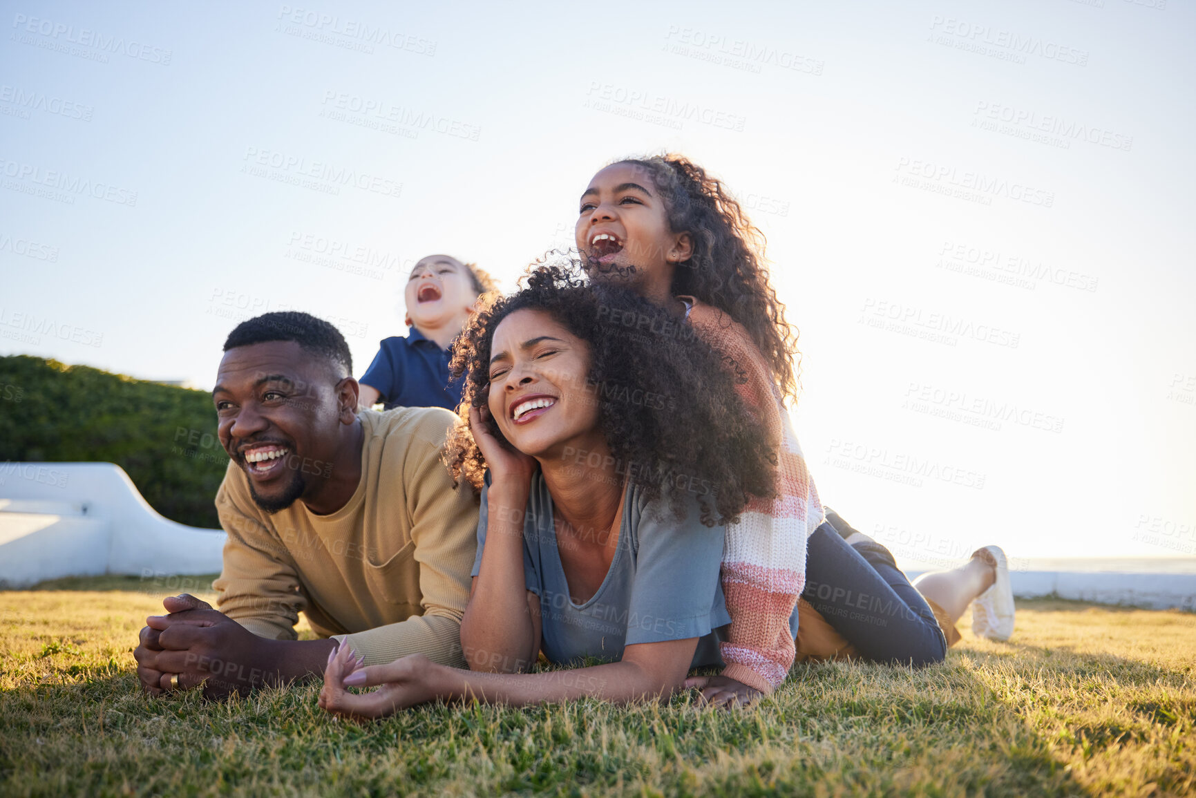 Buy stock photo Grass, funny and family relax on vacation, bonding and having fun together on mockup space. Children, laughing and interracial parents in nature to travel on holiday, care and love outdoor at garden