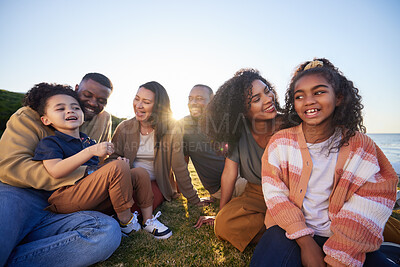 Buy stock photo Parents, grandparents and children on grass outdoor laughing together on funny vacation in summer. Interracial family on beach for holiday picnic with smile of men, women and kids for generation love