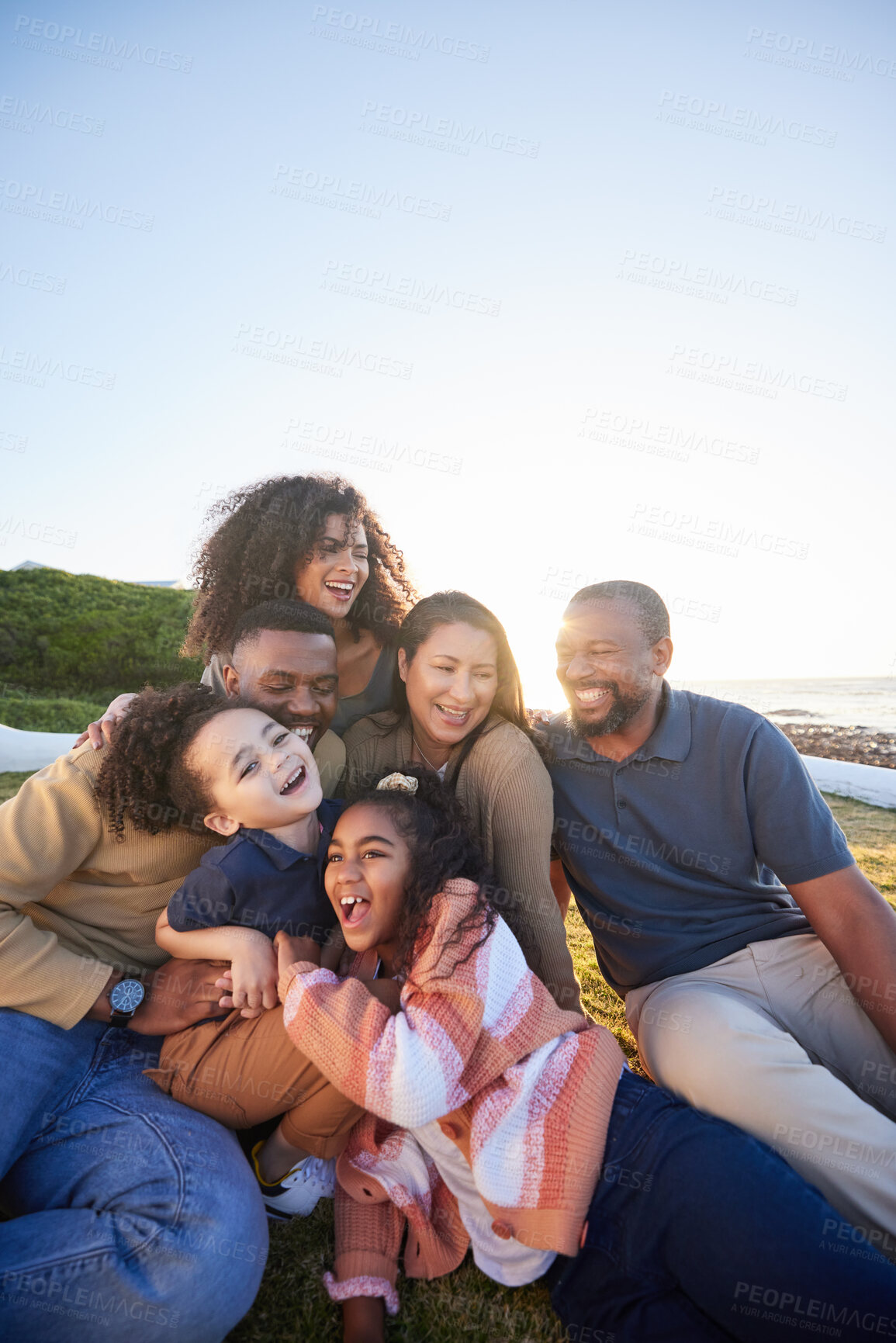 Buy stock photo Family, laughing and outdoor with fun together with parents, kids and grandparents on holiday. Vacation, hug and happy mother, dad and young children with funny joke and game on grass with bonding