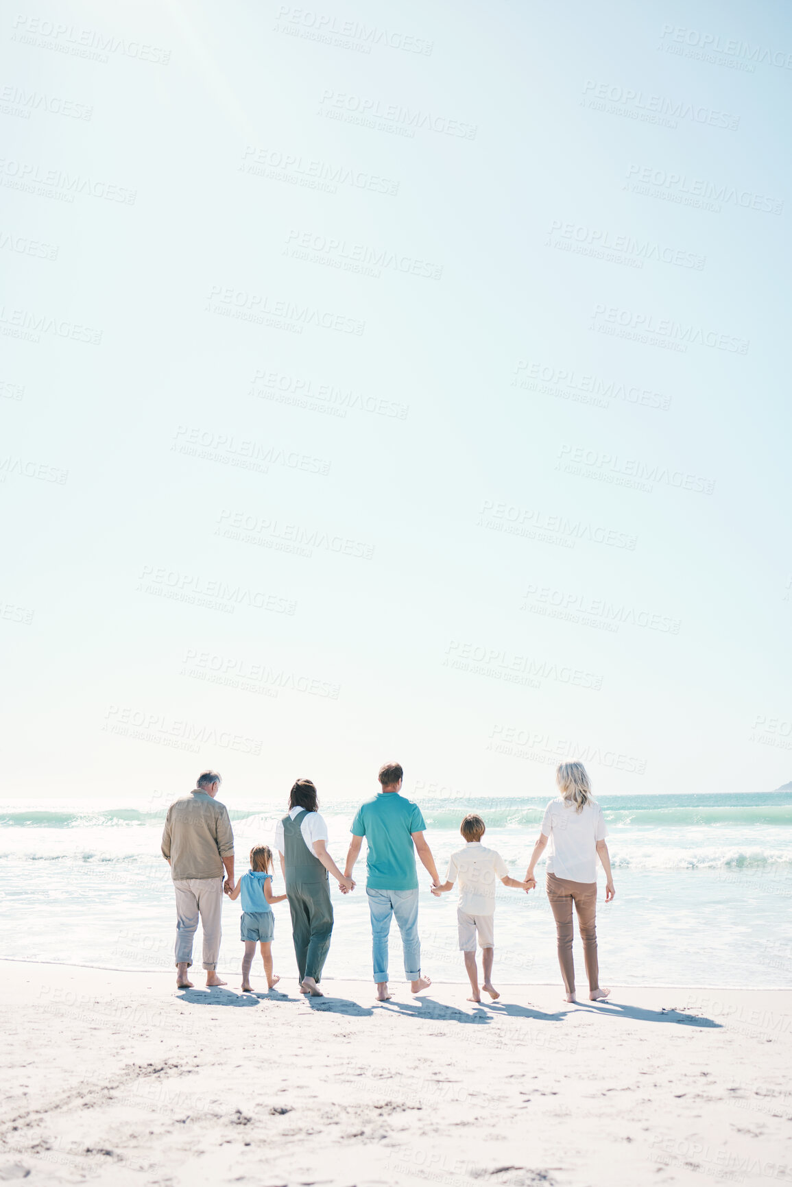 Buy stock photo Big family, beach and summer vacation on mockup in travel, outdoor holiday or together on sunny day. Rear view of parents, grandparents or kids on ocean coast in fun bonding or break at sea in nature