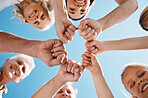 Happy big family, hands and fist bump in teamwork, motivation or unity for support or trust on sky background. Closeup of people smile touching in team collaboration, community or outdoor happiness