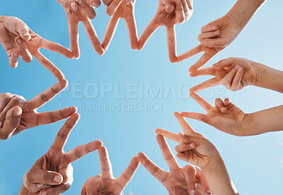 Buy stock photo Hands, group and fingers in star for peace, collaboration and solidarity on blue sky in low angle. Family, shape and connection to network, team support and freedom of friends in cooperation to trust