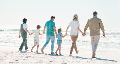 Buy stock photo Love, travel and holding hands with big family on the beach for support, summer vacation or bonding. Freedom, health and relax with people walking on seaside holiday for adventure, trust or happiness