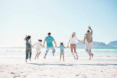 Buy stock photo Jump, travel and holding hands with big family on the beach for support, summer vacation or bonding. Freedom, health and love with people on seaside holiday for adventure, trust or happiness together