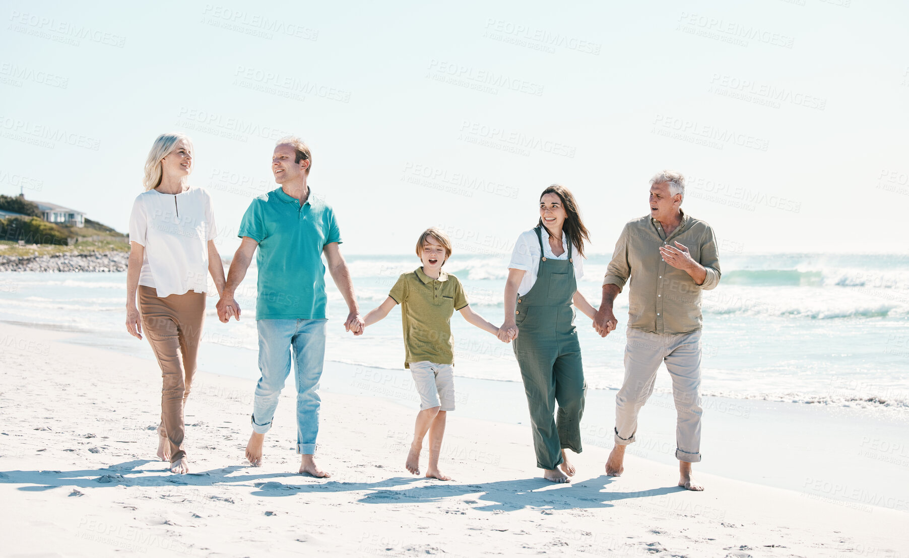 Buy stock photo Walking, beach and family holding hands together on vacation, holiday or tropical weekend trip. Happy, travel and child with parents and grandparents bonding by ocean or sea on adventure in Australia