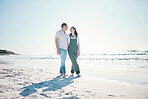 Beach, happy couple walking and love on vacation, holiday or bonding in summer on mockup space. Smile, man and woman at ocean to travel, romance and healthy connection in relationship at sea together