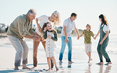 Buy stock photo Grandparents, kids and big family with play at beach, comic laugh or bonding for love, sunshine or excited on vacation. Men, women and children by sea, waves or happy for holiday for summer in Spain