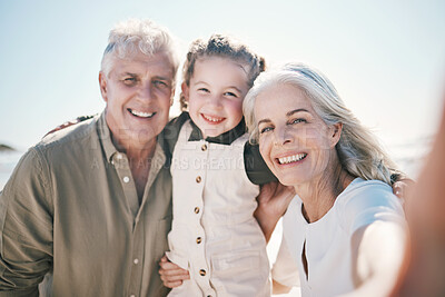 Buy stock photo Family, selfie and beach holiday with grandparents and young girl together with a smile. Happy, child and portrait at the sea and ocean with a profile picture pov for social media on summer vacation 