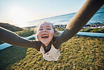 Happy, kid and spinning pov at beach, having fun or play outdoor at sea. Excited girl, child and swing at sea, funny game and laughing to smile on holiday vacation to travel in summer at ocean sunset