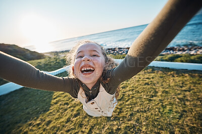 Buy stock photo Happy, kid and spinning pov at beach, having fun or play outdoor at sea. Excited girl, child and swing at sea, funny game and laughing to smile on holiday vacation to travel in summer at ocean sunset