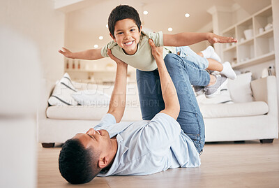 Buy stock photo Portrait, child and dad in home for airplane games, support and relax on ground for crazy fun. Father, happy boy or kid excited to fly on floor for freedom, fantasy or balance of play, care or energy