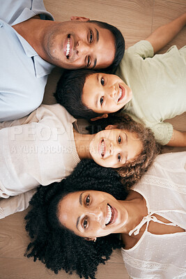 Buy stock photo Top view, smile and portrait of family on floor, bond or having fun together. Face, happy children and mother and father on ground for support, love or care of parents in healthy relationship at home