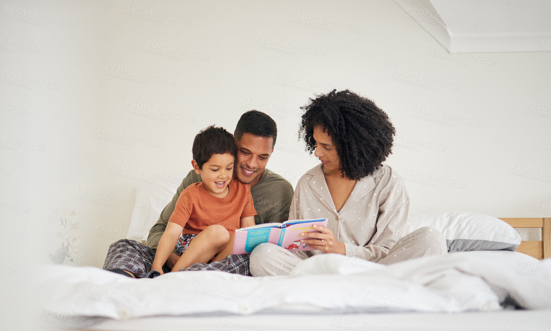 Buy stock photo Family, parents and child reading book in bed with bonding, love and education during storytelling time at home. Learning, knowledge and story, man with woman and kid in bedroom, support and help