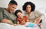 Family, parents and kid reading book in bed with bonding, love and education during storytelling time at home. Learning, knowledge and story, man with woman and child in bedroom with happiness