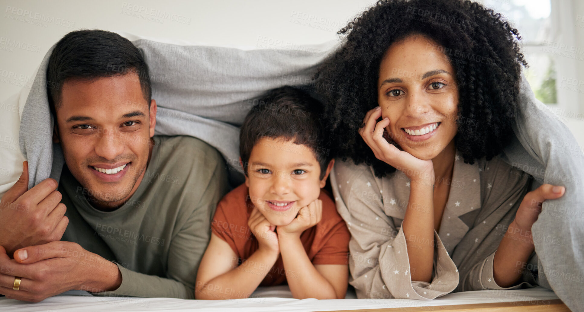 Buy stock photo Portrait, relax and smile with a family in the bedroom of their home together in the morning. Face, happy or love with a mother, father and son in bed on the weekend during summer vacation or holiday