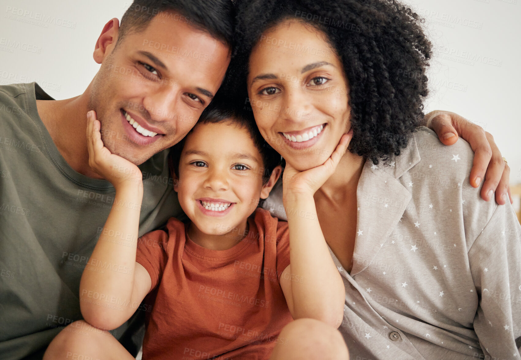 Buy stock photo Portrait, love and smile with a family in bed while at home together in the morning. Face, happy or relax with a mother, father and son the bedroom on a weekend during summer vacation or holiday