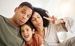 Portrait, peace sign and funny face with a family in the bedroom of their home together in the morning. Smile, love or happy with a mother, father and son in bed on the weekend during summer vacation