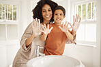 Mother, child and cleaning hands, soap in bathroom with hygiene and skincare in portrait with morning routine. Foam, palm and health, woman and boy at family home, handwashing and germs with wellness