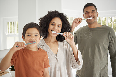 Family, brushing teeth in portrait and dental, morning with parents and child in bathroom, routine and hygiene. Grooming, health and oral care, orthodontics and toothbrush with people at home