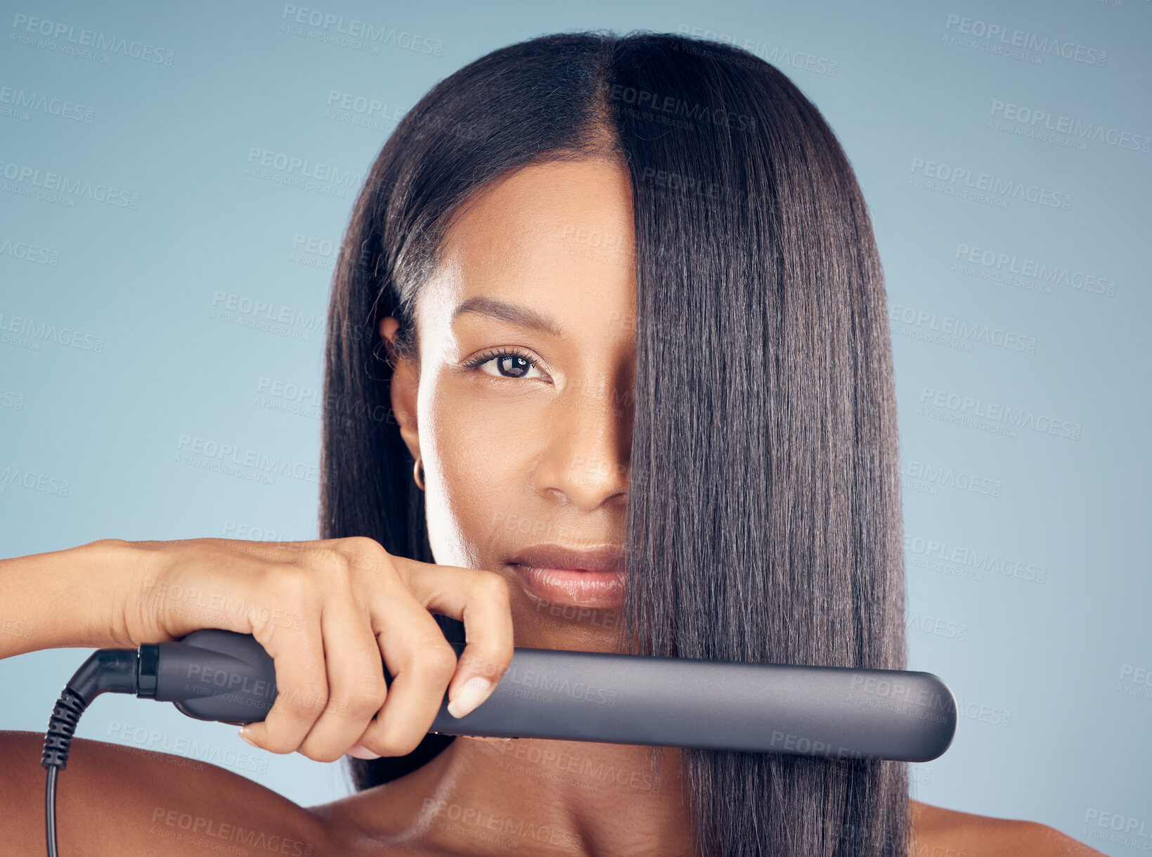 Buy stock photo Iron, hair care or portrait of woman in studio or salon for keratin growth, healthy shine or beauty product. Face, flat straightener or model in spa for hairstyle grooming results on blue background 