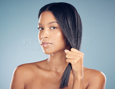 Buy stock photo Strong, hair care or portrait of woman in studio or salon for keratin growth, healthy shine or beauty. Face, hand pulling or confident model in spa for hairstyle grooming results on blue background 