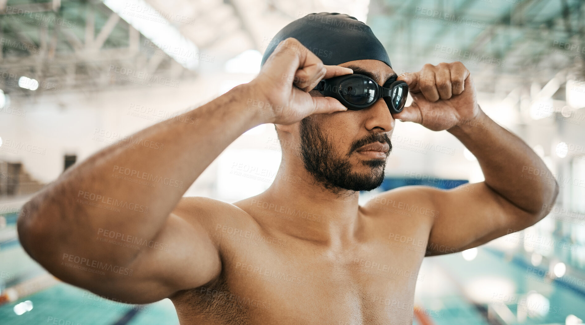 Buy stock photo Getting ready, man and goggles for swimming training, competition or a race in the pool. Fitness, gym and an athlete or swimmer with glasses to start exercise, workout or cardio in a triathlon