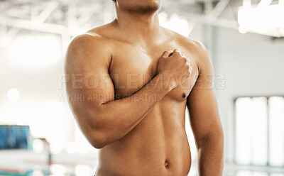 Buy stock photo Athlete, man and hand on chest with pride for national anthem at sport event or olympic competition by indoor swimming pool. Swimmer, person and shirtless for fitness, performance or lifestyle