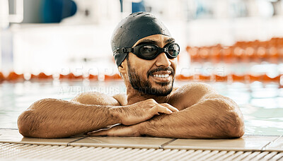 Buy stock photo Happy, man and athlete in swimming pool after training, workout or exercise for wellness, performance or cardio fitness. Swimmer, relax and smile with sports, goggles or cap for competition and race