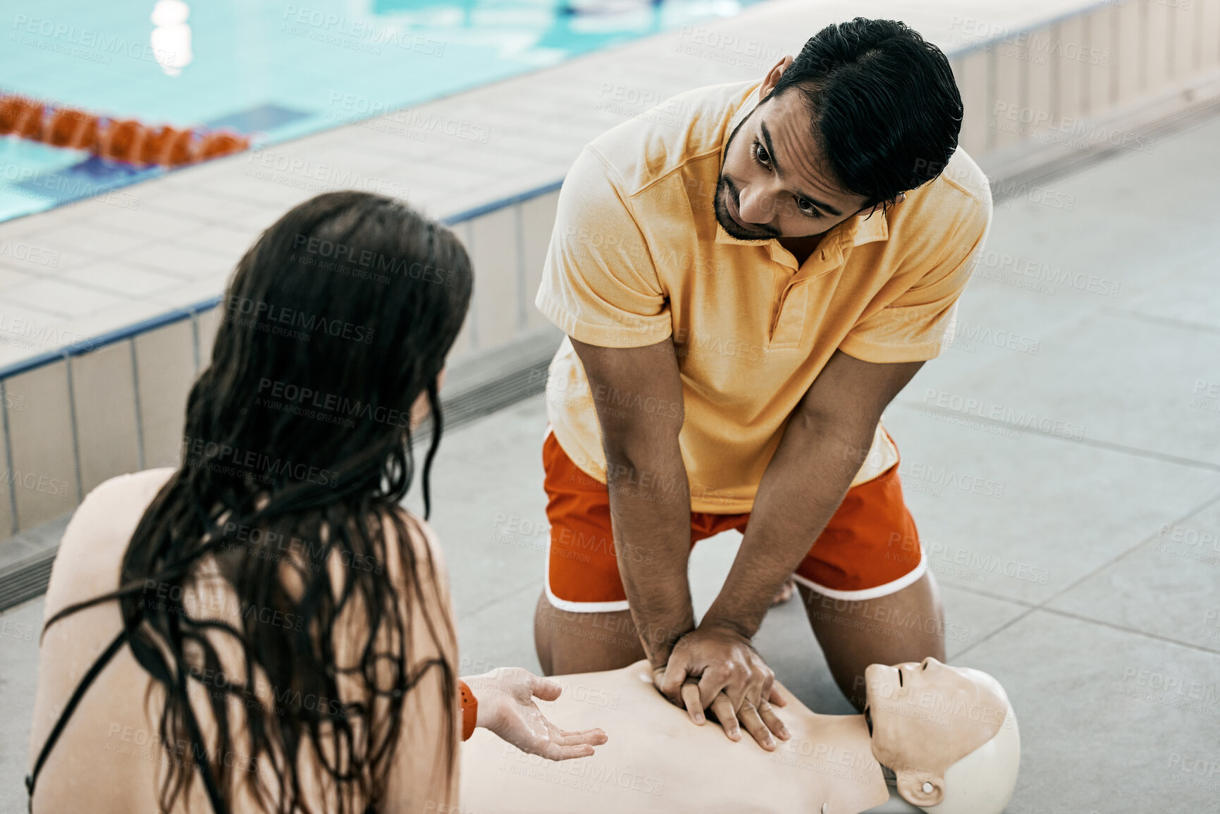 Buy stock photo Swimming pool safety, first aid and man teaching life saving process rescue support or helping with danger. Client, emergency CPR and person learning medical service, lifeguard or practice on dummy 