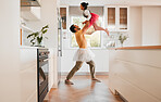 Dancing, ballet and dad with a child together in a kitchen with fun and game with tutu. Dancer, funny and happy family in a home with a father and girl with bonding, love and laughing from dance