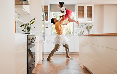 Buy stock photo Dancing, ballet and dad with a child together in a kitchen with fun and game with tutu. Dancer, funny and happy family in a home with a father and girl with bonding, love and laughing from dance