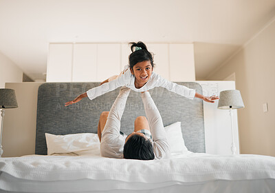 Buy stock photo Portrait, child and dad on bed for airplane games, support and relax for crazy fun together at home. Father, girl kid and excited to fly for freedom, fantasy and balance for play, trust and energy 