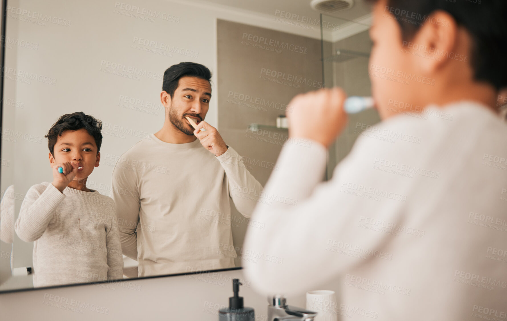 Buy stock photo Dad, boy and child brushing teeth in mirror for hygiene, morning routine and teaching healthy oral habits at home. Father, kid and dental cleaning in bathroom with toothbrush, fresh breath and care 