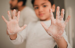 Child, hands and soap, cleaning and hygiene, grooming and safety from bacteria with closeup at home. Health, wellness and protection, foam and palm with young person learn handwashing and skincare