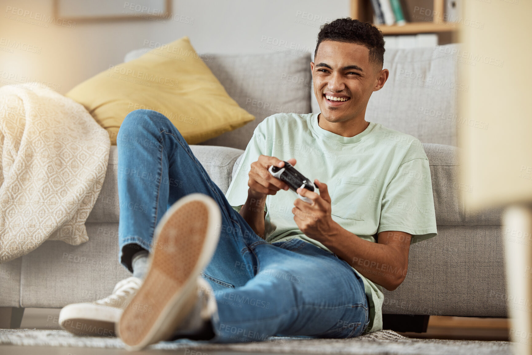 Buy stock photo Living room, floor and man playing video game online with controller happy for virtual challenge and excited in home. Internet, user experience and person or gamer streaming sports games in apartment