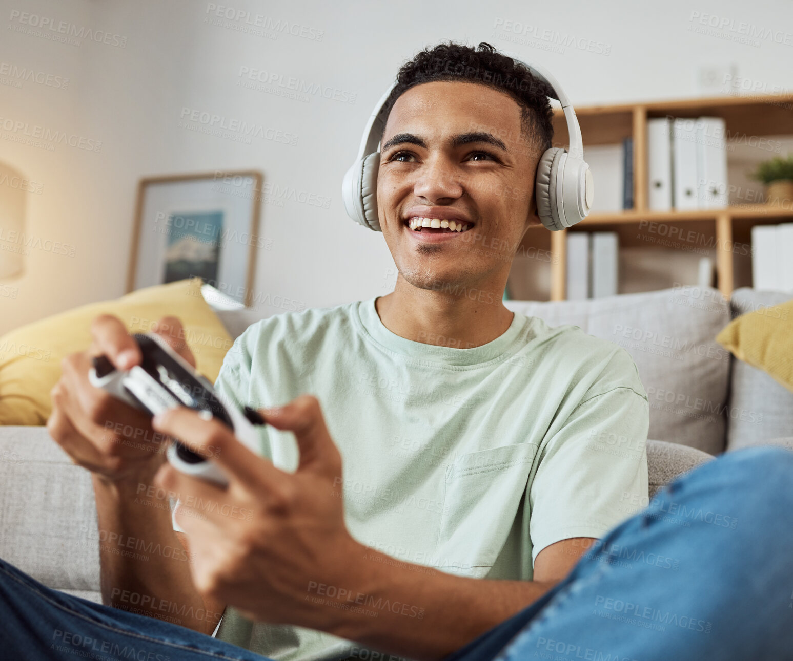 Buy stock photo Home, game controller and man with headphones, relax and connection on a couch, sound and internet. Happy person, gamer and guy on a sofa, playing online and headset with audio, smile and esports