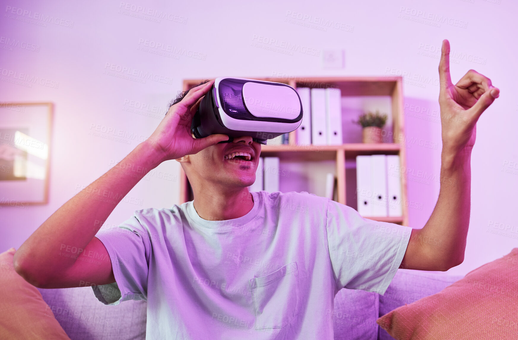 Buy stock photo VR glasses, living room and man with gaming, metaverse and finger touch in a home. Streaming, virtual reality and happy smile of a male person with gamer headset with esports and 3d cyber tech 