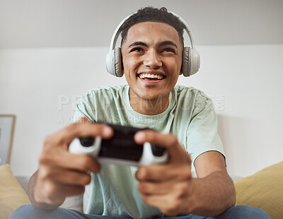 Buy stock photo Headphones, esport and man happy for video game online with controller playing virtual challenge and excited in living room. Internet, user experience and person or gamer streaming sports games