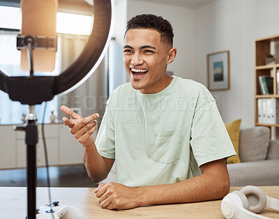 Buy stock photo Influencer, live streaming and man gamer talking on social media for connection on online vlog in a home with smile. Ring light, streamer and content creation person speaking on internet show as host