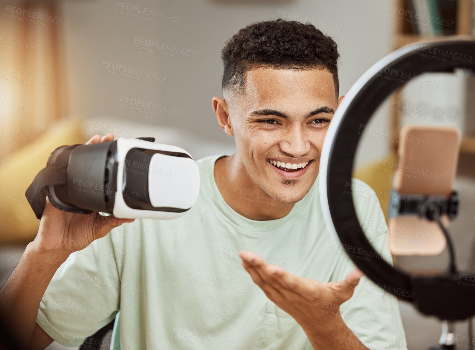 Buy stock photo Ring light, influencer and man with virtual reality headset review in his home live streaming to blog or podcast. Social media, feedback and male gamer with vr goggles for esports, gaming or update  