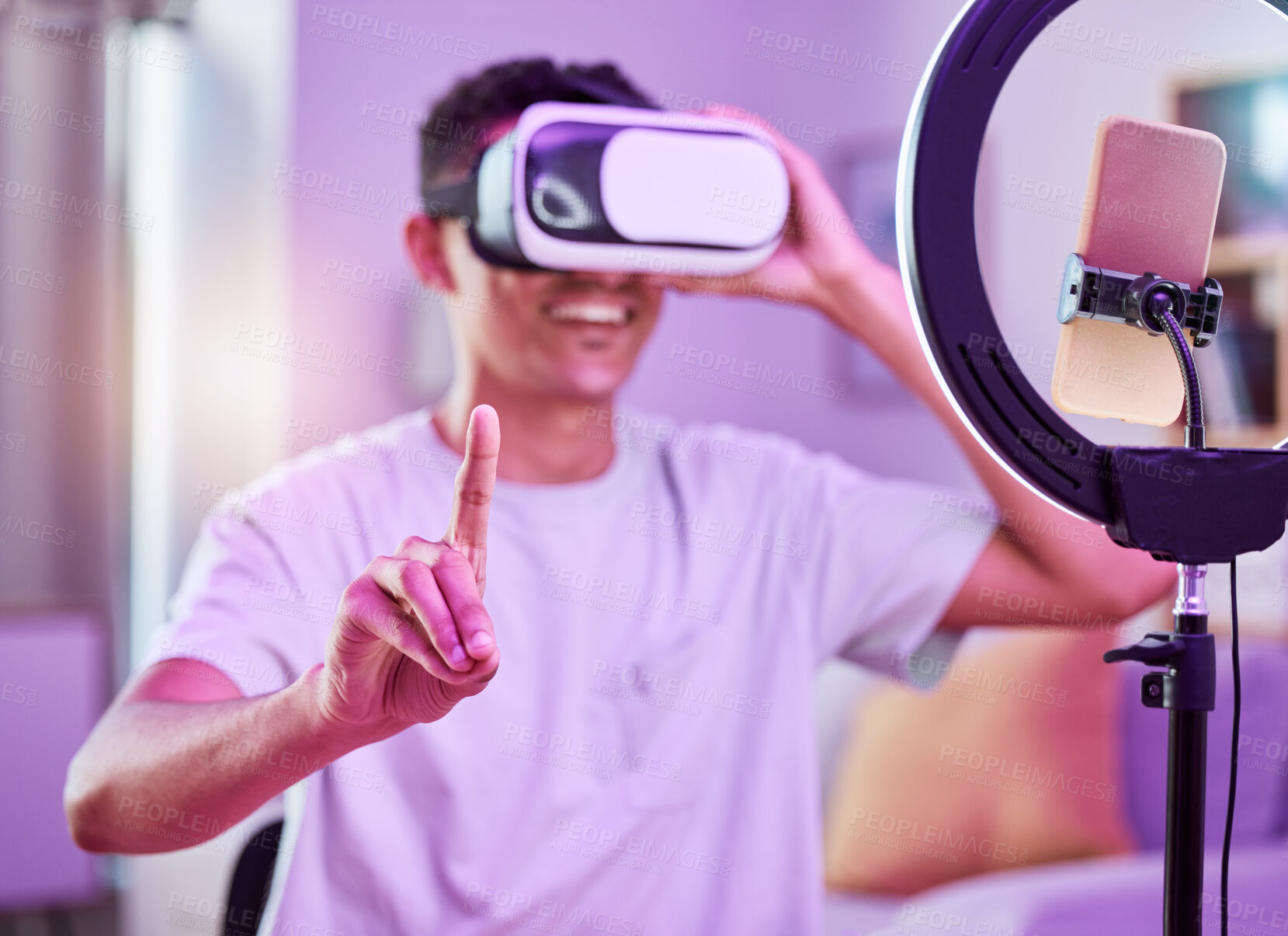 Buy stock photo VR, live streaming and man content creator with future on social media for digital connection in metaverse vlog in a home. 3D, streamer and influencer or person speaking on internet show as host