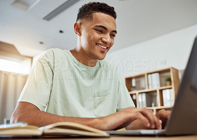 Buy stock photo Man, student and typing at laptop with education and notes, writing report for university and happy studying at home. Online, productivity and knowledge, academic growth and development for college