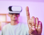 VR glasses, living room and man finger with gaming, metaverse and touch in a home. Streaming, virtual reality and happy smile of a male person with gamer headset with esports and 3d cyber tech 