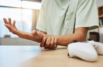 Buy stock photo Gaming, hand pain and man in living room with carpal tunnel, inflammation or esports injury zoom. Wrist, injury and male gamer with arthritis, fibromyalgia or osteoporosis, accident or anatomy crisis